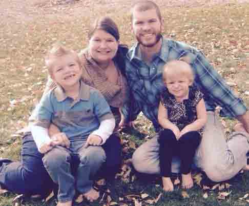 Sheila Osmond taking picture with her family.
